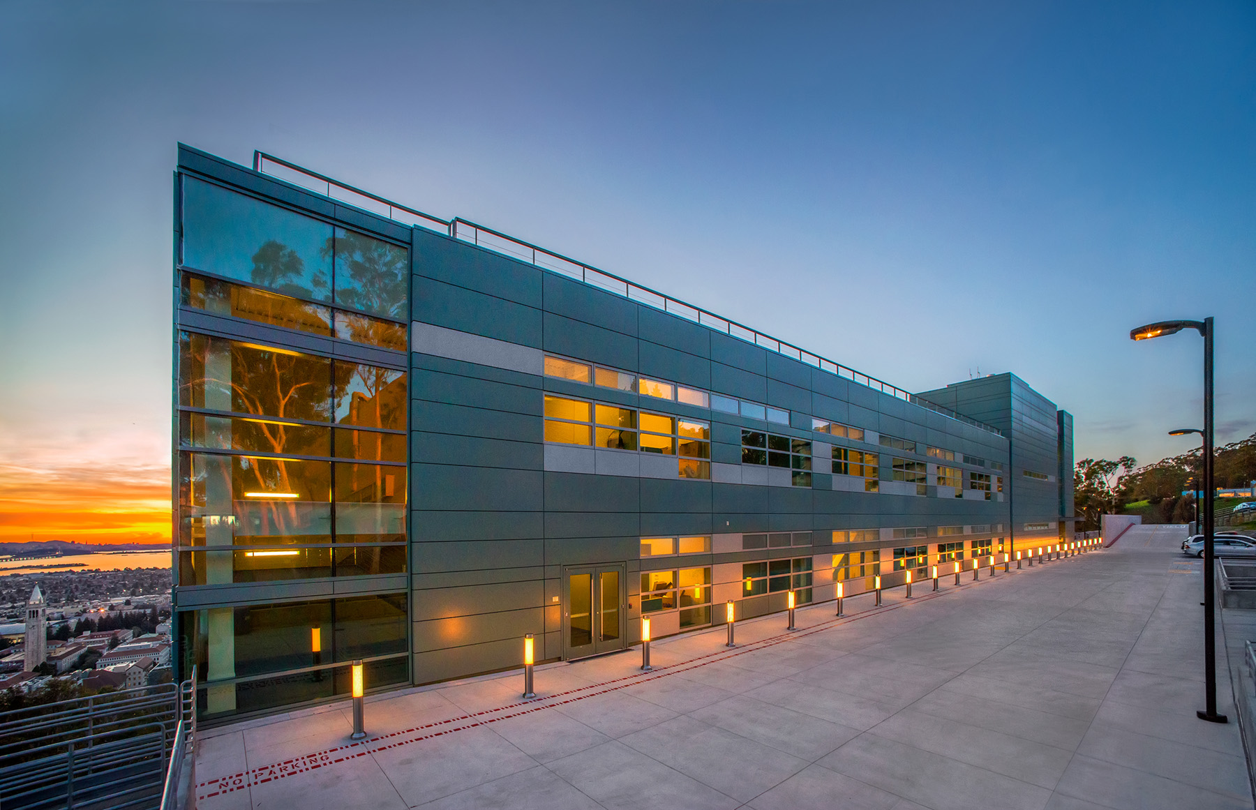 An exterior shot of Berkeley Lab's Wang Hall at sunset