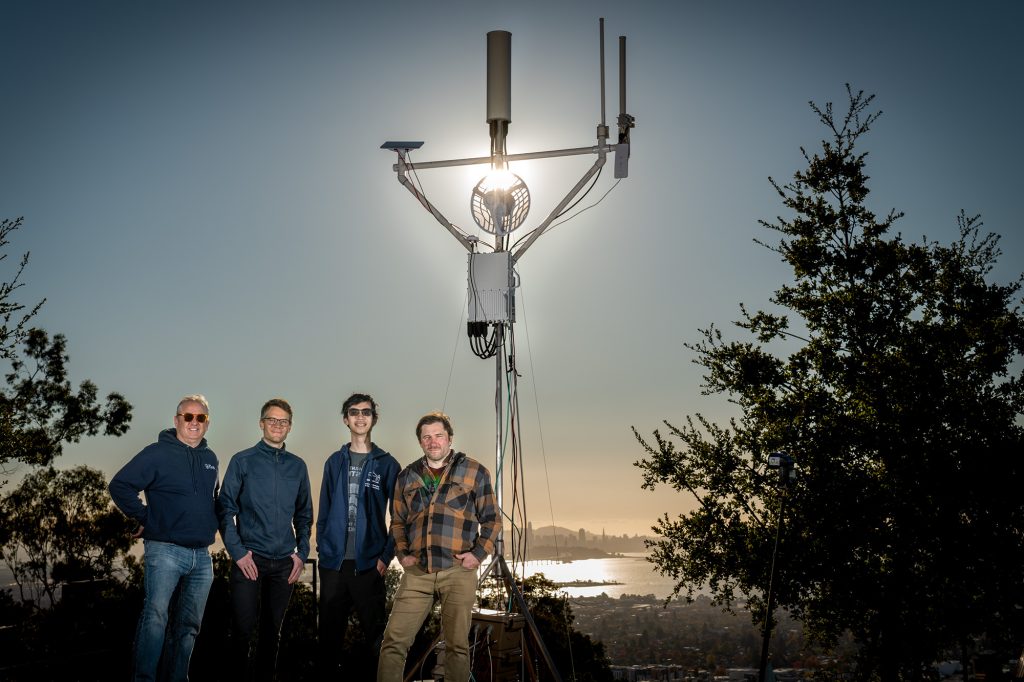 Andrew Wiedlea (ESnet), Stijn Wielandt (Earth and Environmental Sciences Area), Howard Yao (EESA), and James Kafader (ESnet) with the Greenfield Wireless Edge prototype at Berkeley Lab in November 2024.