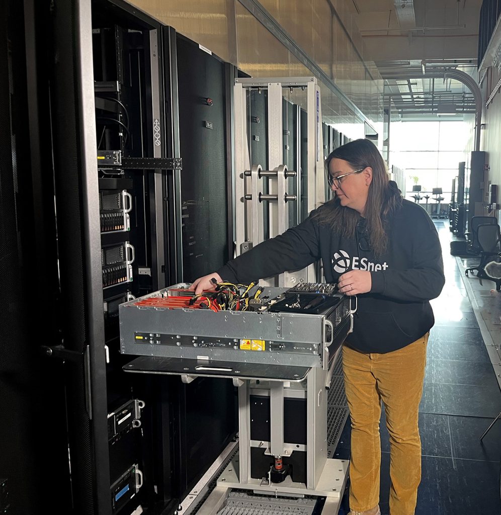 Person adjusting hardware on a rack